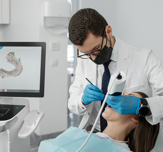 Dentist performing a dental procedure on a patient