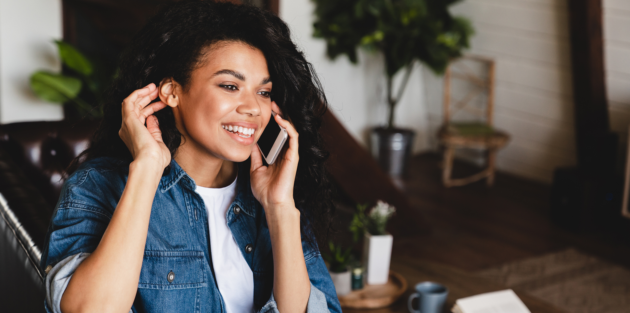 Woman talking on the phone with dental office in Bartlett
