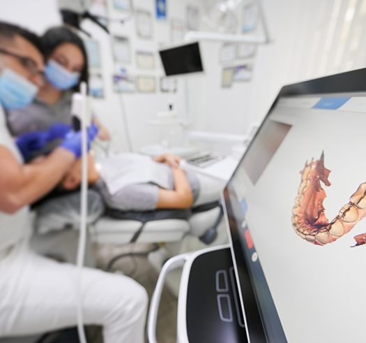 Dental patient having digital impressions taken of their teeth