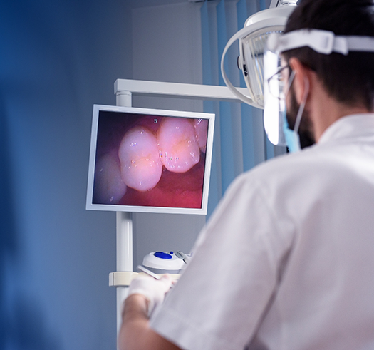 Dentist capturing close up photos of a patients teeth