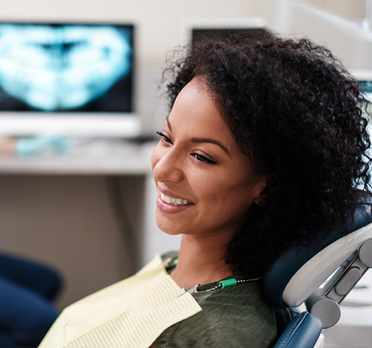 Smiling woman sitting in the dental chair