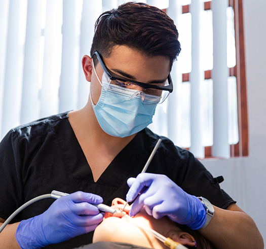 Dentist performing a dental procedure on a patient