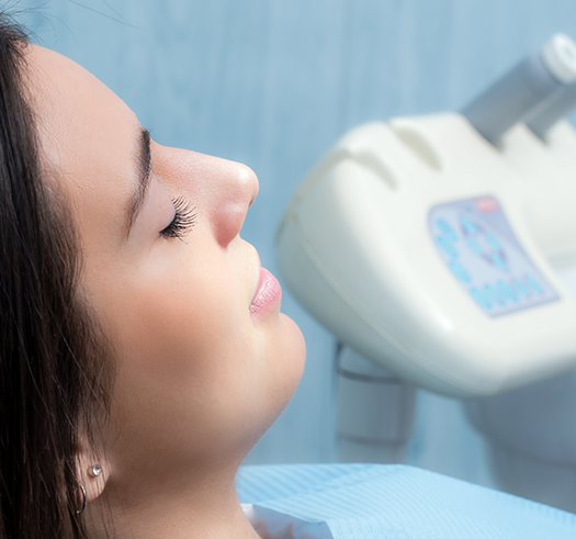 Woman with her eyes closed in the dental chair